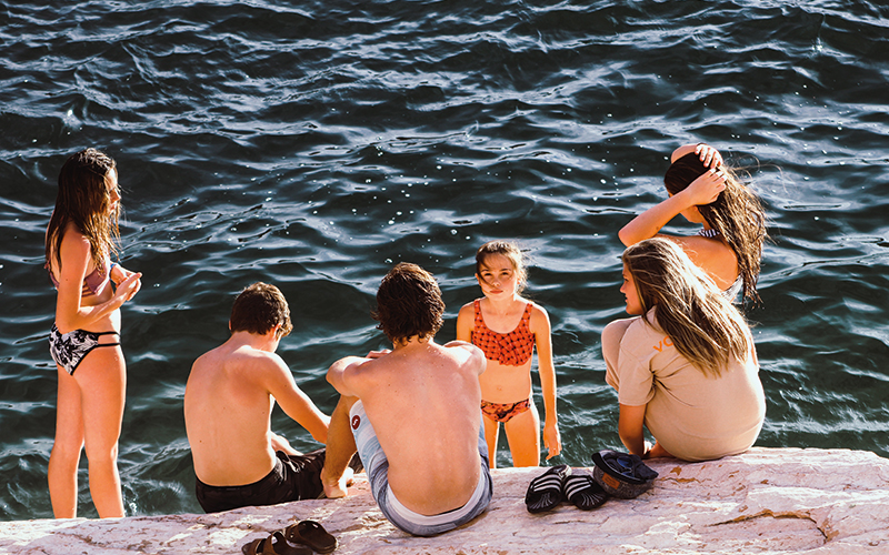 Group of friends playing in the water