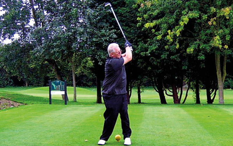 Man playing golf
