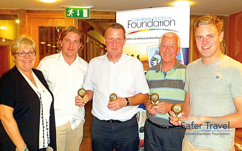 Richard Stuttle, Marjorie Marks-Stuttle and others with golf trophies