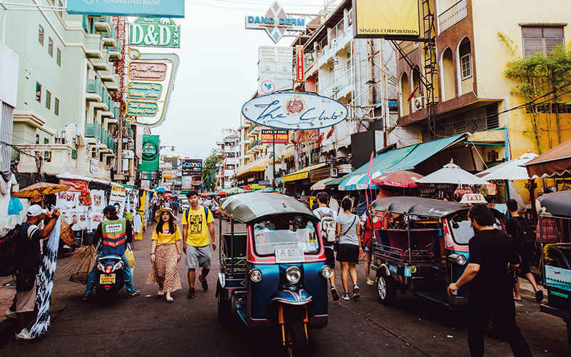 People walking along busy street in Thailand