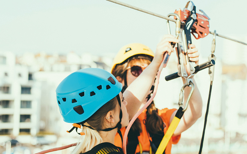 Girl preparing to go on zip line