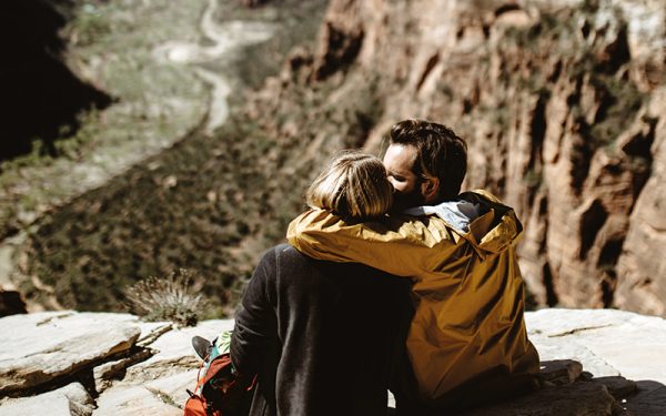 Couple kissing on rocks