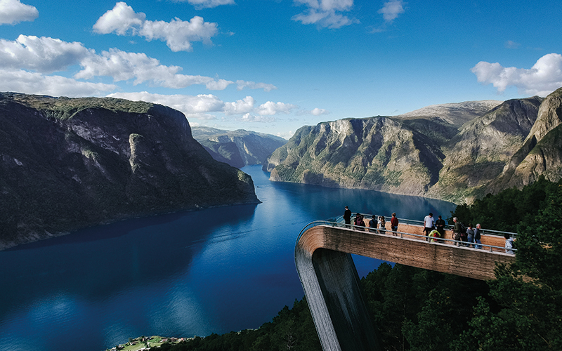 People looking at river from observation tower