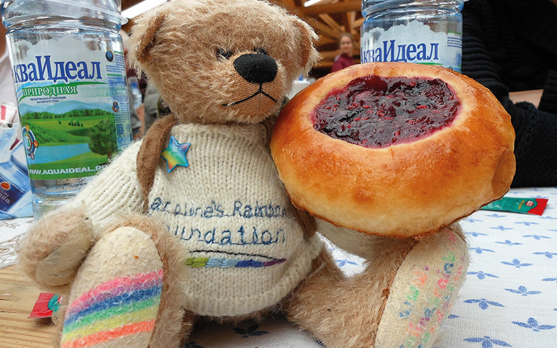 Rainbow Bear with cake and drinks