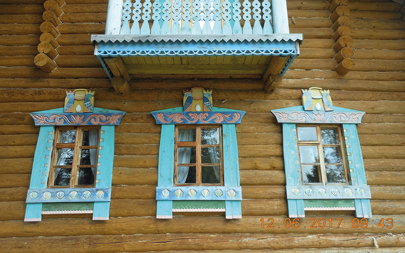 Brown buildings with blue window frames