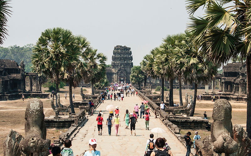 People walking down path in Asia