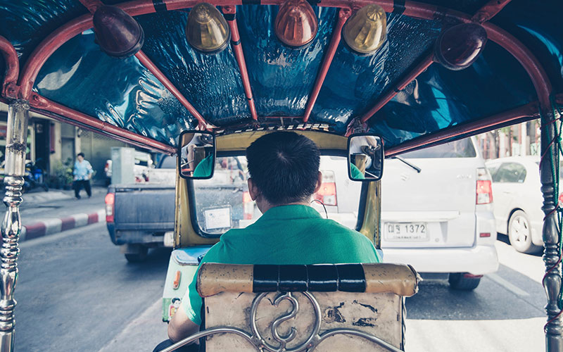 Man driving on the road in Asia