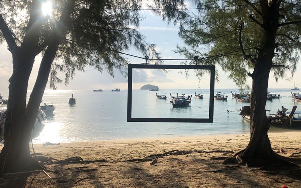 Photo frame with boats by the beach