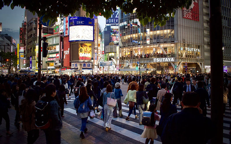 People crossing very busy street