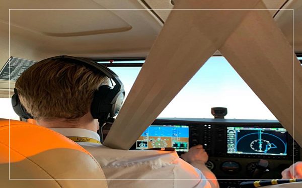 Pilot in cockpit of plane