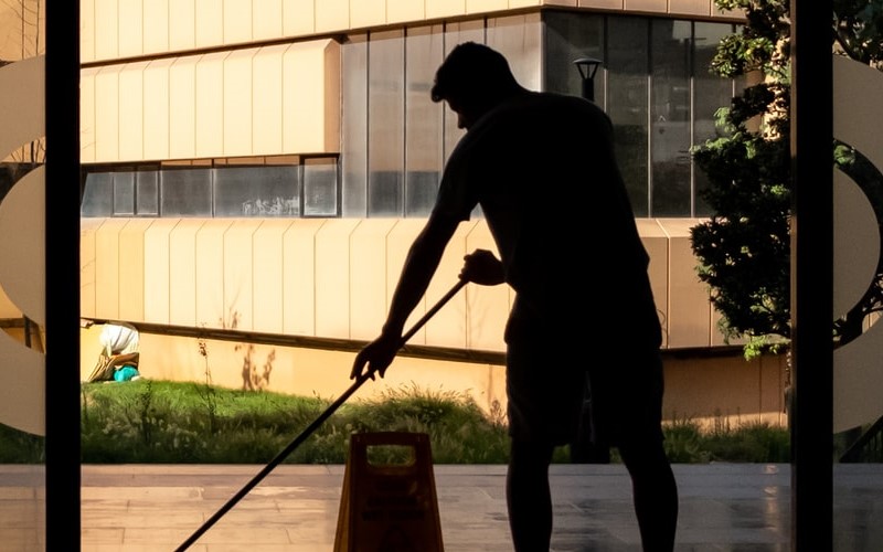 Man cleaning hotel lobby