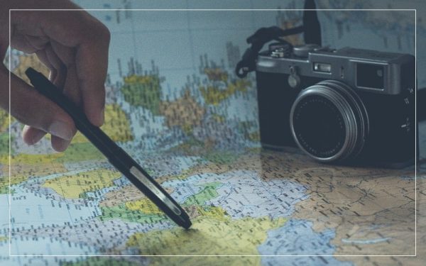 Person reading map with camera in the background