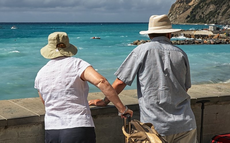 Older couple looking at the sea