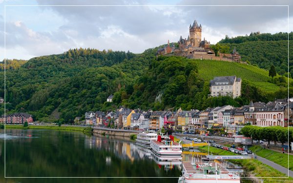 German village and castle overlooking a lake