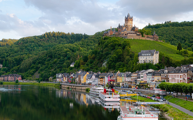 German village and castle overlooking lake