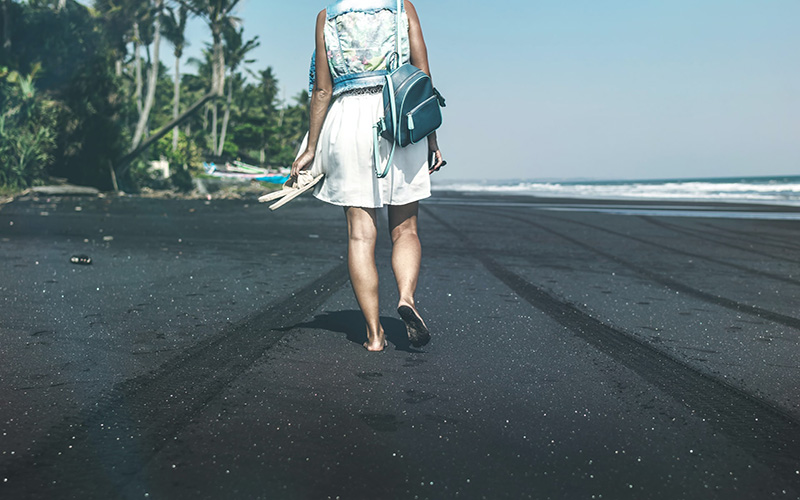 Woman walking on beach