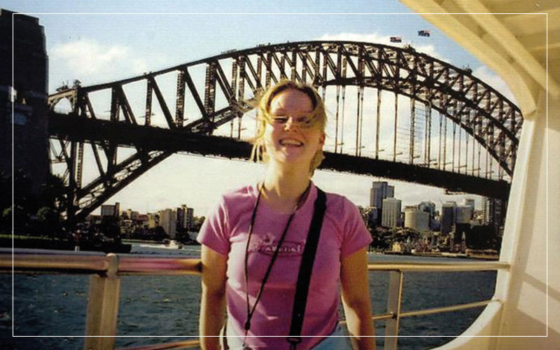 Caroline Stuttle smiling in front of a bridge