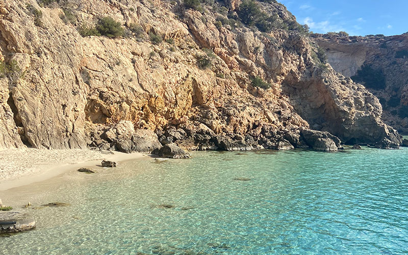 Spanish cove tucked away behind cliffs