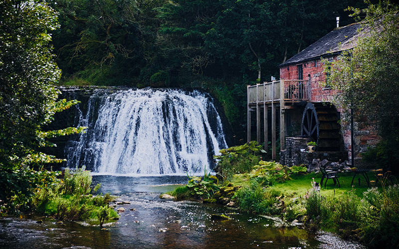 UK holiday cottage with waterfall next to it