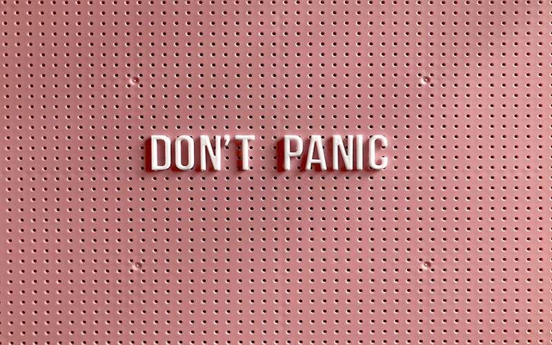 don't panic text pink background