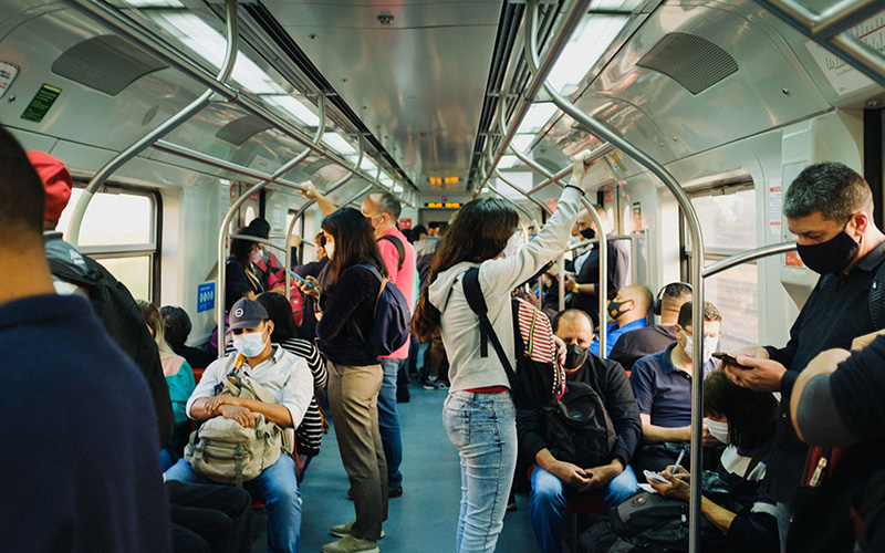 A busy train with lots of people