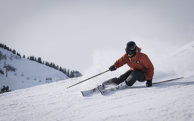 Woman skiing down mountain